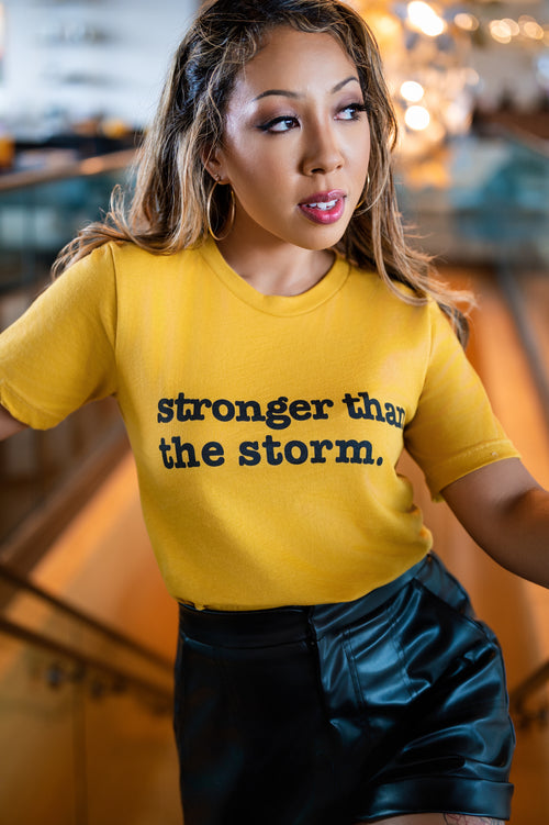 Stronger Than The Storm Unisex T-Shirt- Black Writing