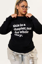 This Is A Chapter, Not The Whole Story Unisex Premium Sweatshirt - Black Writing